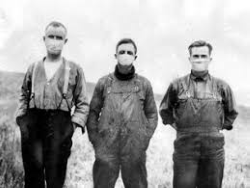 three men wearing face masks