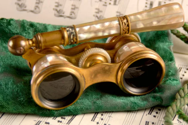 Opera glasses and sheet music