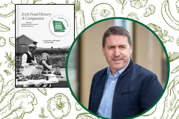 Image of Máirtín Mac Con Iomaire with his book 'Irish Food History'