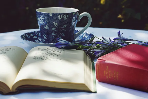 poetry book, teacup and flowers