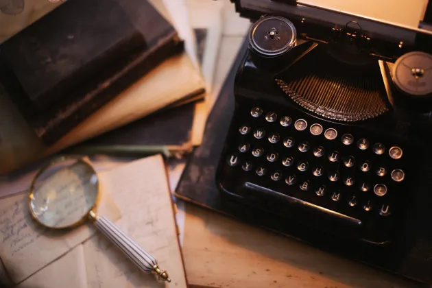 Image of laptop and magnify glass