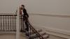 newlyweds kiss on grand staircase in city hall