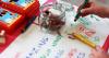 a child draws with crayons