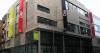 a tall building block with colourful signs reading 'the LAB'