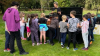 Children gathered around in a park 