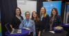 five women at a stand on National Women's Enterprise Day