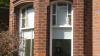 briack house with two windows
