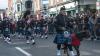 band performing in the sreet with a large dog by their side