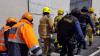 Fire Brigade escorting injured body
