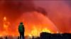 Man overlooking a wild fire 