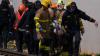 Group of paramedics escorting an injured person