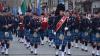 Band members playing in a busy street in dublin on st.patricks day