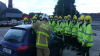 Image of fire brigade trainees around car