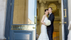 just married couple embracing on city hall steps