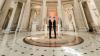 wedding couple stand under city hall rotunda