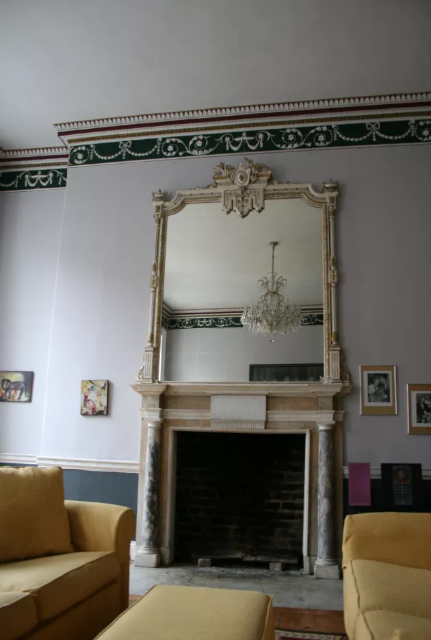 Fireplace surround to principal first floor front living room