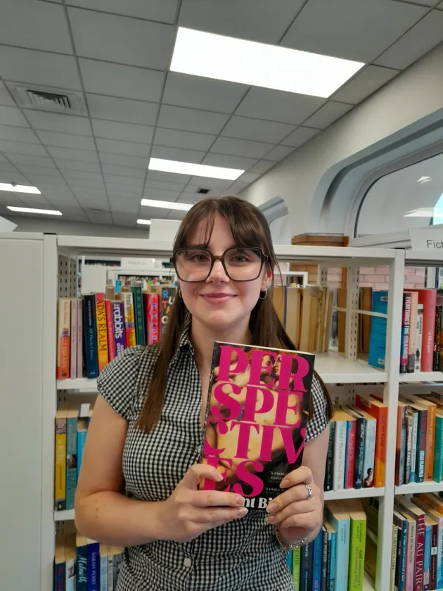 Librarian holding book