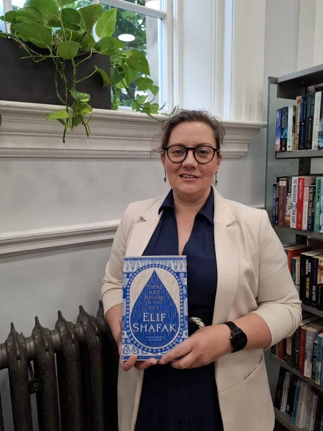 Librarian holding book