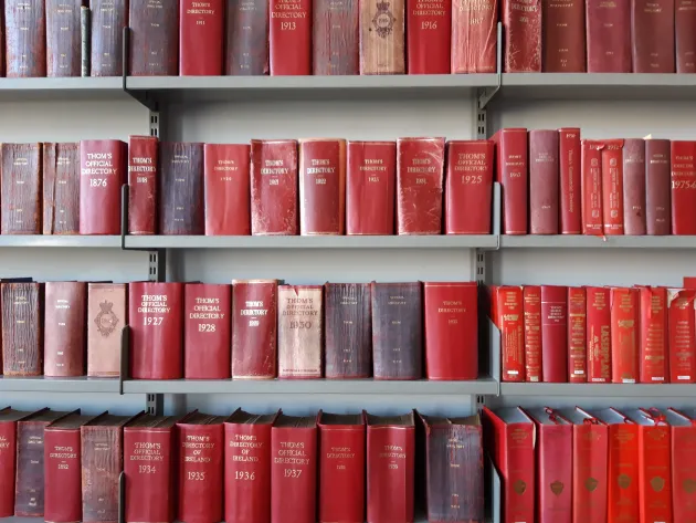 Thoms Directories shelved on wall