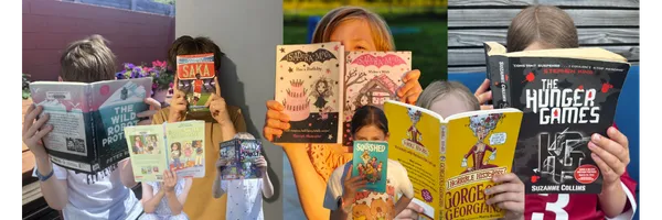 Image is of kids holding books up in front of their faces.