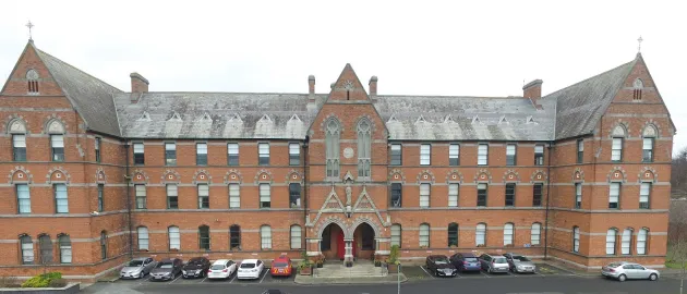 facade of the O'Brien Institute a grand red brick French Gothic style building