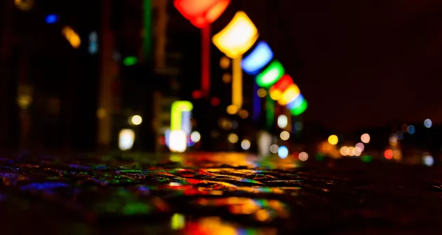 Photo of street lit up at night