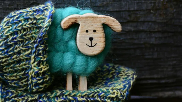 knitted hat with wooden sheep