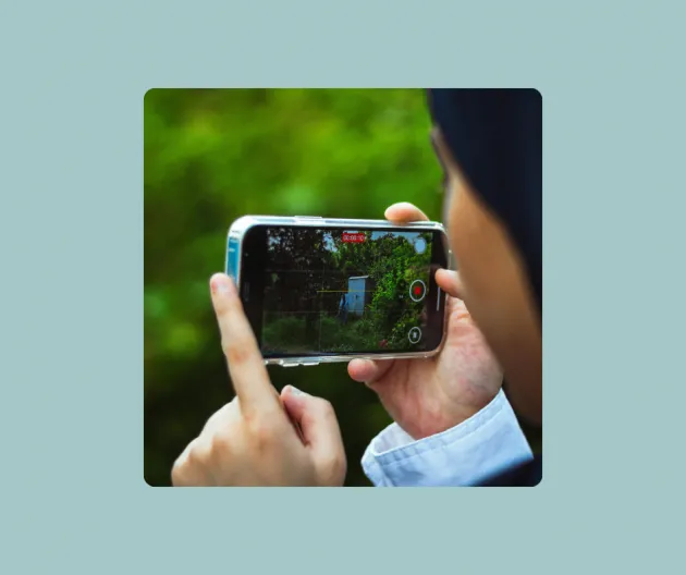 Image of someone taking a photograph using a smartphone