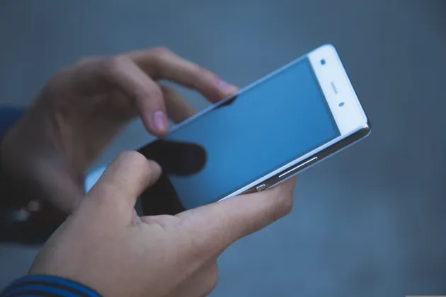 Image of person using smartphone