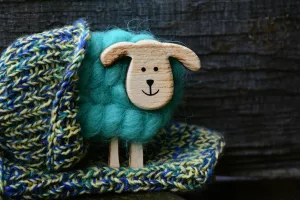 knitted hat with wooden sheep