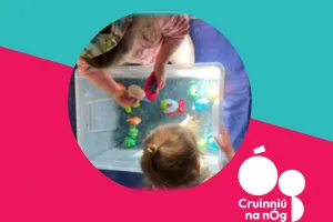 Image of children playing with sensory toys with Cruinniú na nÓg logo